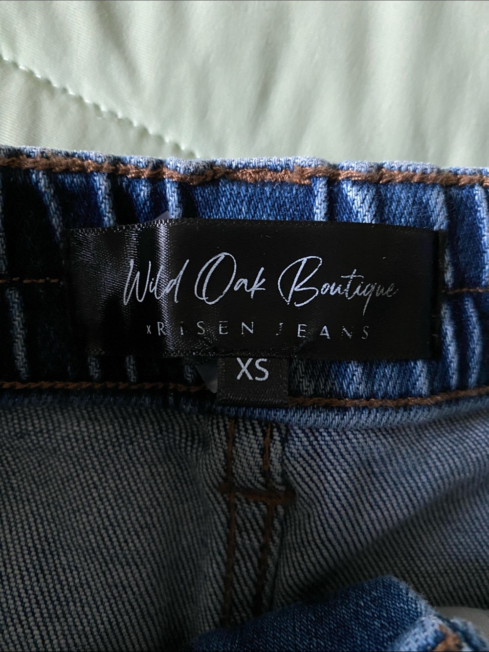 Risen Jeans. Distressed High-Rise Denim Cutoff Shorts in Blue - Picture 2 of 3